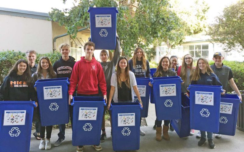 Environmental Club members with new blue recycle bins