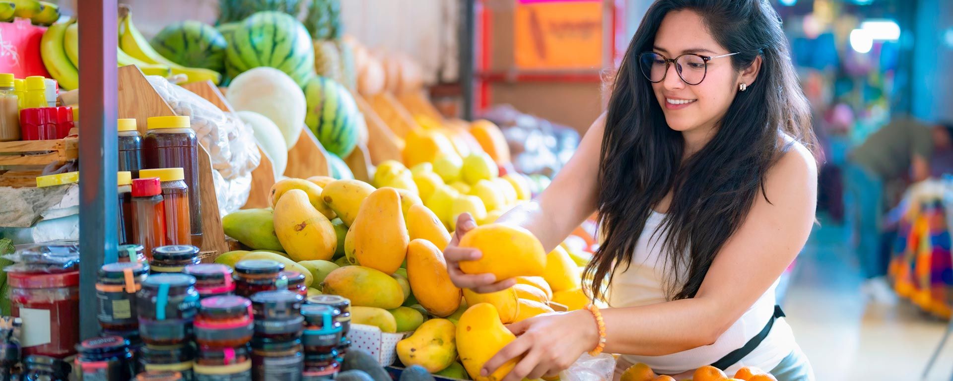Latina woman shopping for produce in a grocery store